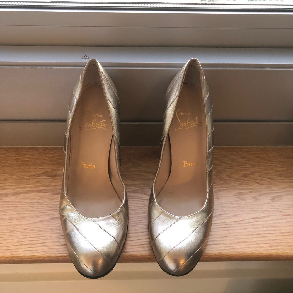 Christian Louboutin gold closed to wedge
